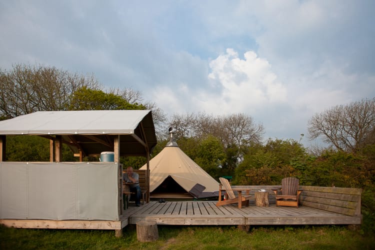 Fforest Camp in Wales. Teepee glamping setup. By Leonie Wise