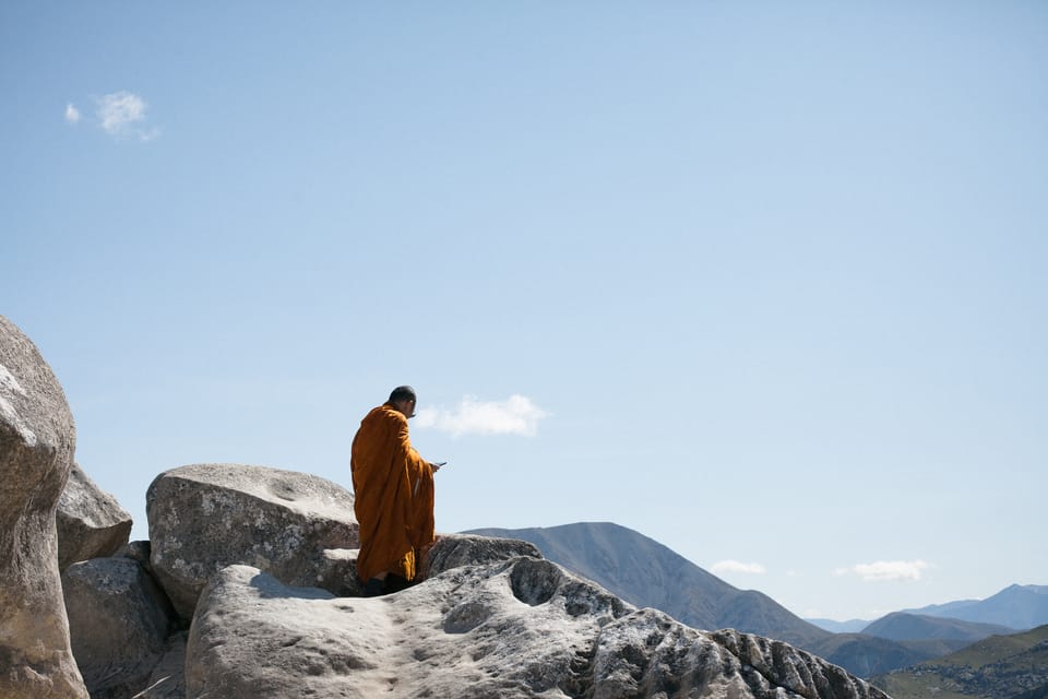 monk with an ipad on castle hill. copyright leonie wise
