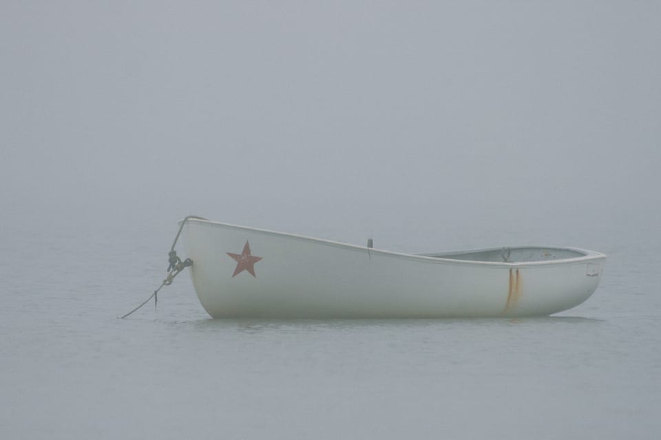 a boat in the fog, provincetown, usa. by leonie wise